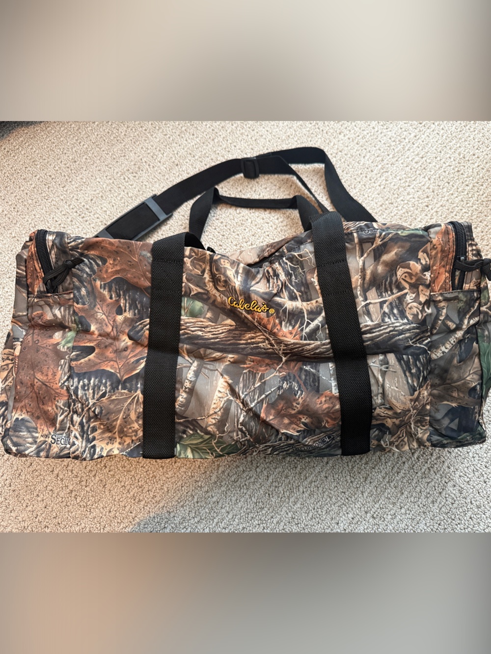 Cabela's Seclusion 3D Camo Duffel with Black Straps